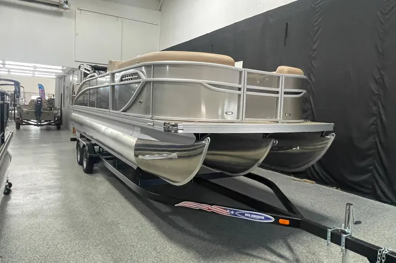 The Image of 2026 Barletta Cabrio 24UE pontoon boat on trailer in showroom. - 0