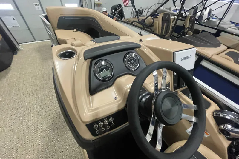 Slide: The Image of 2026 Barletta Cabrio 24UE boat dashboard with steering wheel and controls. - 12