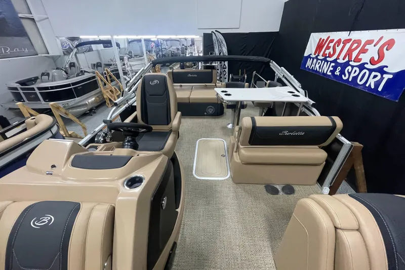 Slide: The Image of 2026 Barletta Cabrio 24UE pontoon boat interior at Westre's Marine & Sport showroom. - 5