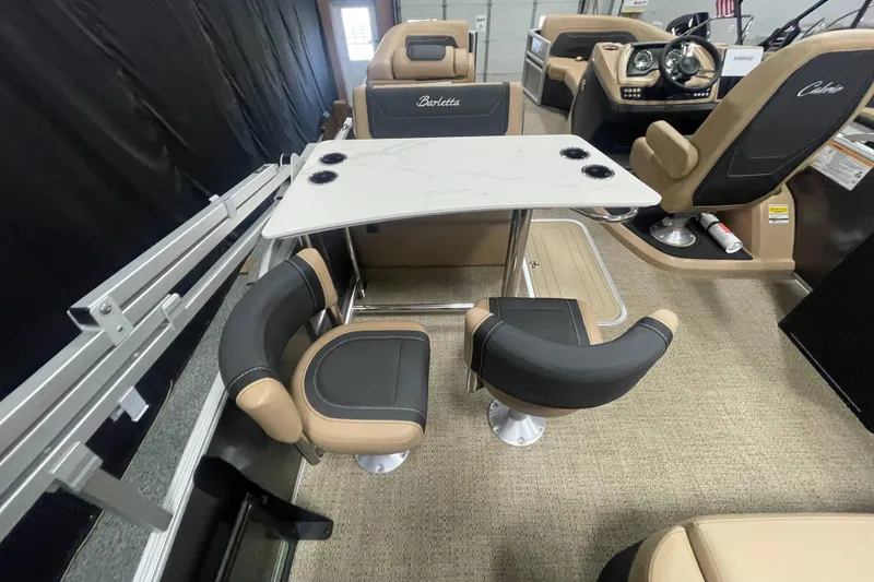 Slide: The Image of 2026 Barletta Cabrio 24UE interior with modern seating and table setup. - 8