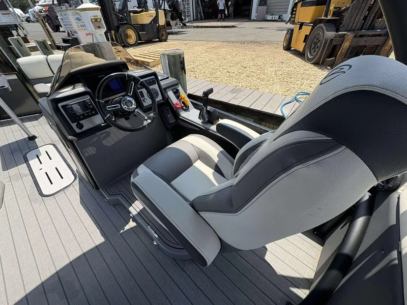 Slide: The Image of 2023 Veranda V25RCT boat cockpit with modern steering and comfortable seating. - 12