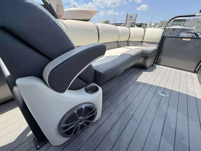 Slide: The Image of 2023 Veranda V25RCT boat interior with luxurious seating and speaker system. - 14