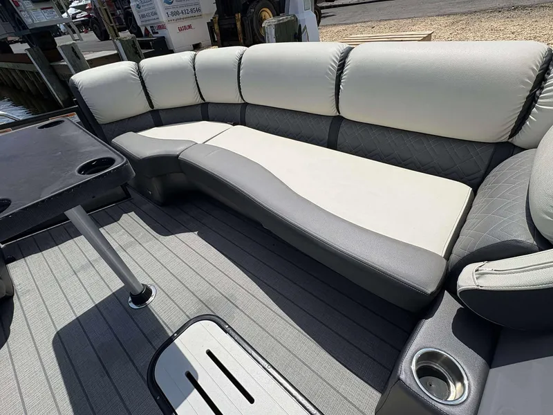Slide: The Image of Luxurious seating on 2023 Veranda V25RCT pontoon boat with cup holders and table. - 18