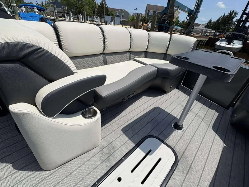 Slide: The Image of Luxurious seating on 2023 Veranda V25RCT pontoon boat with table and cup holders. - 19