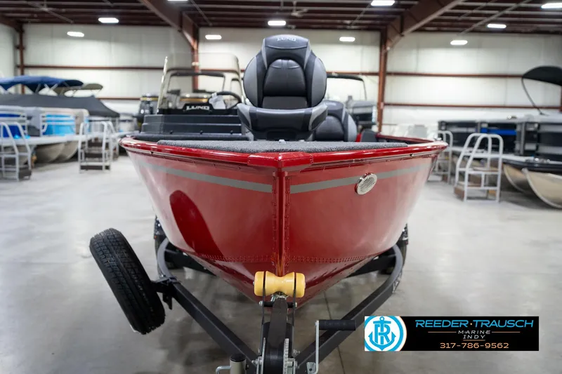 Slide: The Image of 2026 Lund 1650 Rebel XL SS boat in showroom, red exterior, front view. - 3