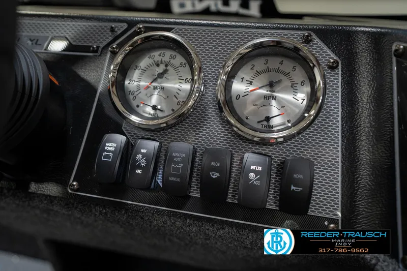 Slide: The Image of Dashboard of 2026 Lund 1650 Rebel XL SS with gauges and control switches. - 36
