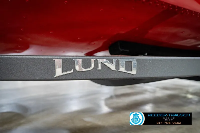 Slide: The Image of 2026 Lund 1650 Rebel XL SS boat with red hull and logo detail. - 57
