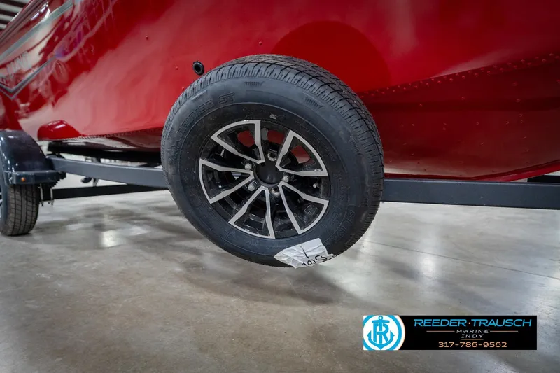 Slide: The Image of 2026 Lund 1650 Rebel XL SS boat trailer with black tire and alloy wheel. - 58