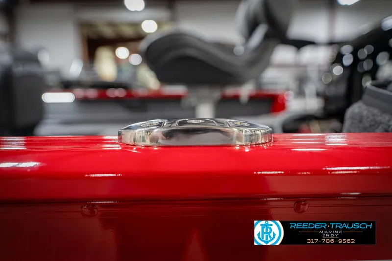 Slide: The Image of 2026 Lund 1650 Rebel XL SS boat detail, red finish, showroom setting. - 59