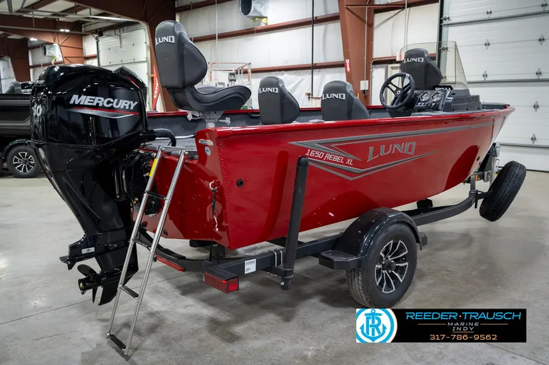 Slide: The Image of 2026 Lund 1650 Rebel XL SS boat with Mercury engine in showroom. - 6