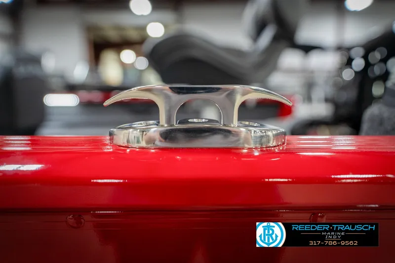 Slide: The Image of 2026 Lund 1650 Rebel XL SS boat cleat on red surface, Reeder-Trausch Marine logo. - 60