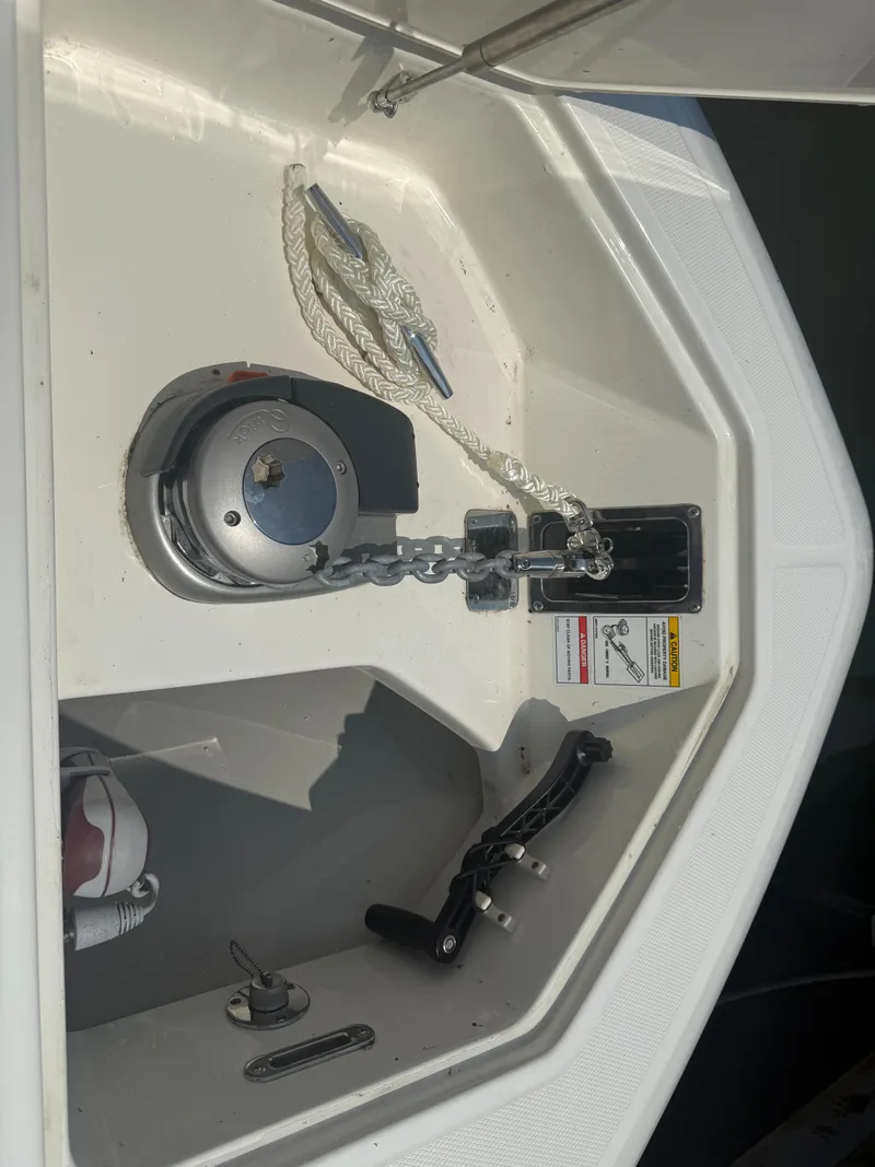 Slide: The Image of 2024 Boston Whaler 330 Outrage anchor locker with chain and rope. - 14