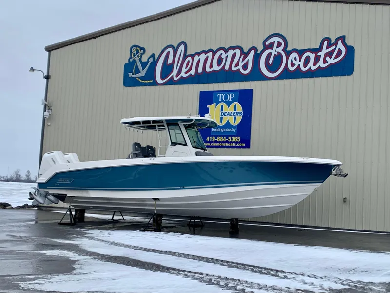 Slide: The Image of 2024 Boston Whaler 330 Outrage boat displayed at Clemons Boats dealership. - 29