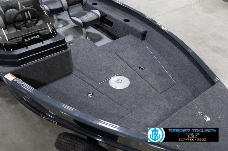 Slide: The Image of 2026 Lund 1775 Adventure SS boat interior with seating and storage compartments. - 10