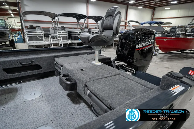 Slide: The Image of 2026 Lund 1775 Adventure SS boat interior with Mercury engine in showroom. - 26