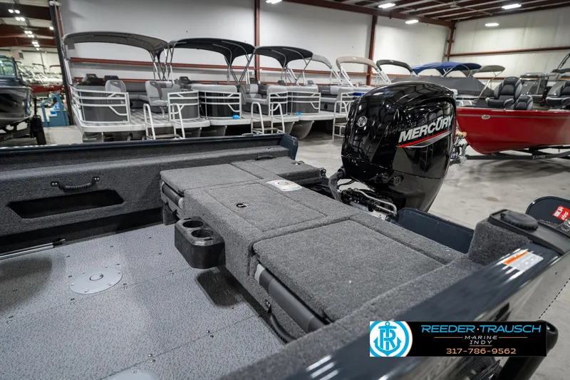 Slide: The Image of 2026 Lund 1775 Adventure SS boat interior with Mercury engine in showroom. - 27