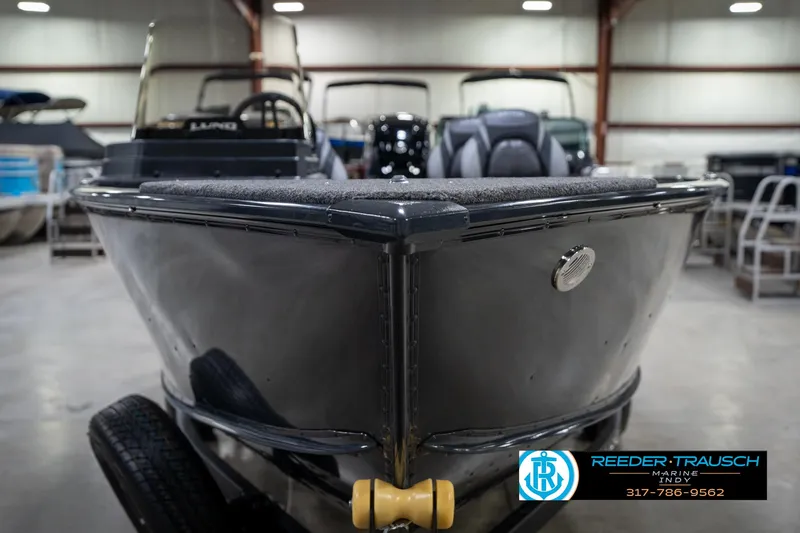 Slide: The Image of 2026 Lund 1775 Adventure SS boat in showroom, Reeder-Trausch Marine logo visible. - 3