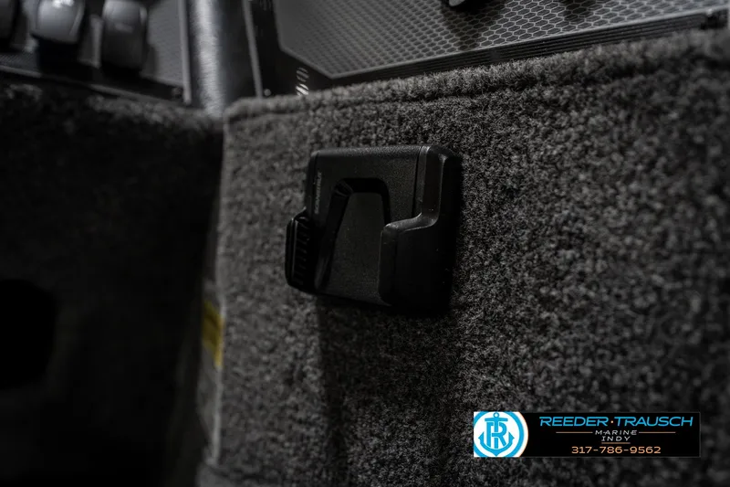 Slide: The Image of Interior detail of 2026 Lund 1775 Adventure SS boat, featuring carpeted surface and latch. - 34