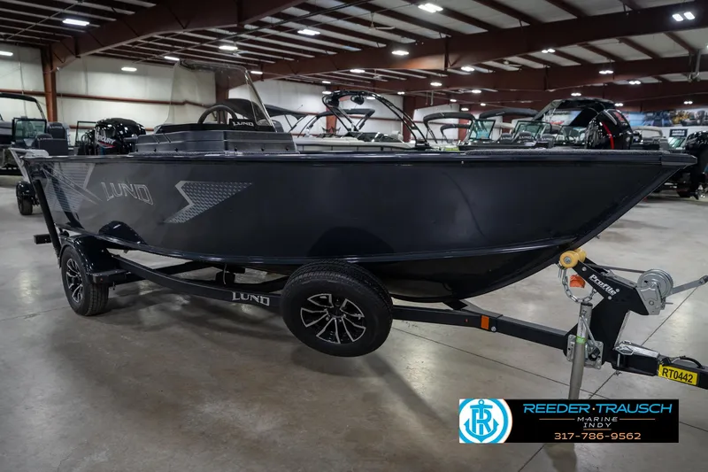 Slide: The Image of 2026 Lund 1775 Adventure SS boat on trailer in indoor showroom. - 4