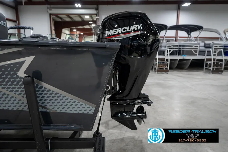 Slide: The Image of 2026 Lund 1775 Adventure SS boat with Mercury outboard motor in showroom. - 46
