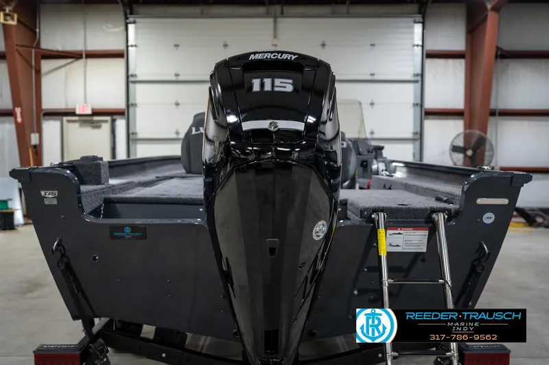 Slide: The Image of 2026 Lund 1775 Adventure SS boat with Mercury 115 engine in a garage setting. - 7