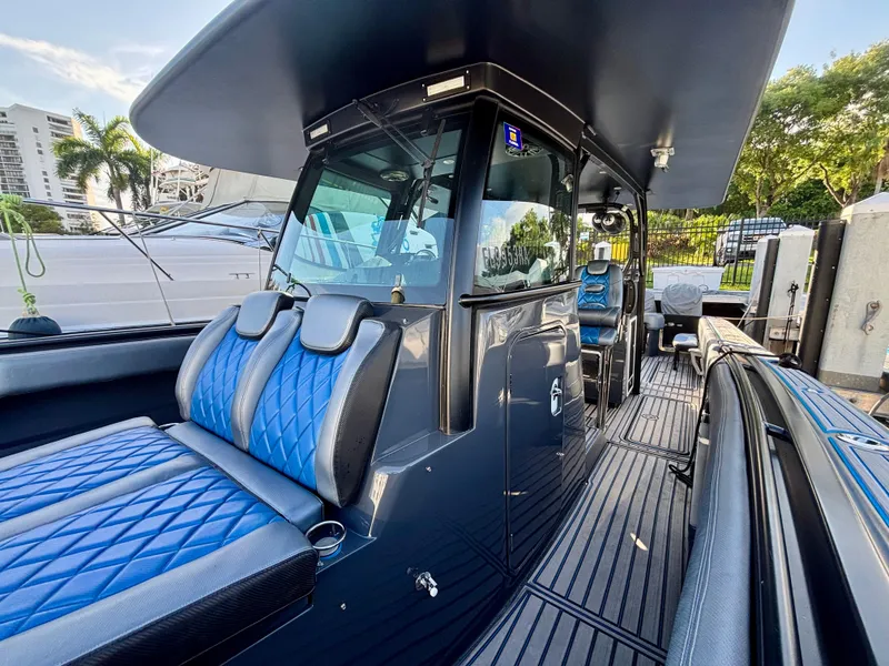Slide: The Image of 2016 Hydra-Sports 4200 Siesta boat interior with blue seating and sleek design. - 16