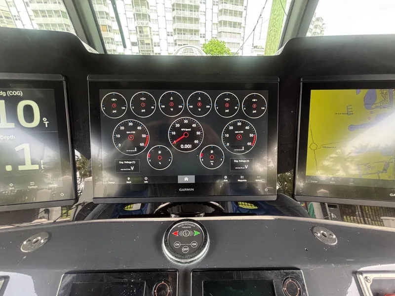 Slide: The Image of Dashboard of a 2016 Hydra-Sports 4200 Siesta with Garmin displays and navigation controls. - 23
