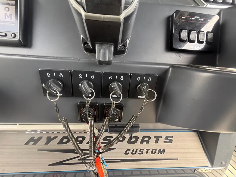 Slide: The Image of Control panel of a 2016 Hydra-Sports 4200 Siesta boat with Yamaha ignition switches. - 30
