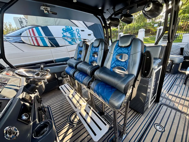 Slide: The Image of Interior of 2016 Hydra-Sports 4200 Siesta boat with blue leather seating and modern controls. - 37