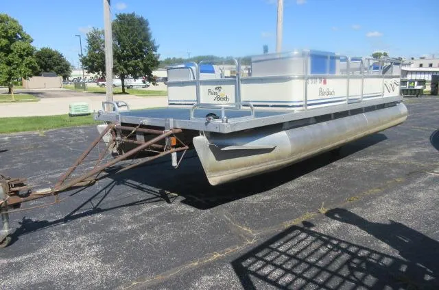 Slide: The Image of 1991 Palm Beach Super 220 pontoon boat on trailer, parked outdoors on sunny day. - 14