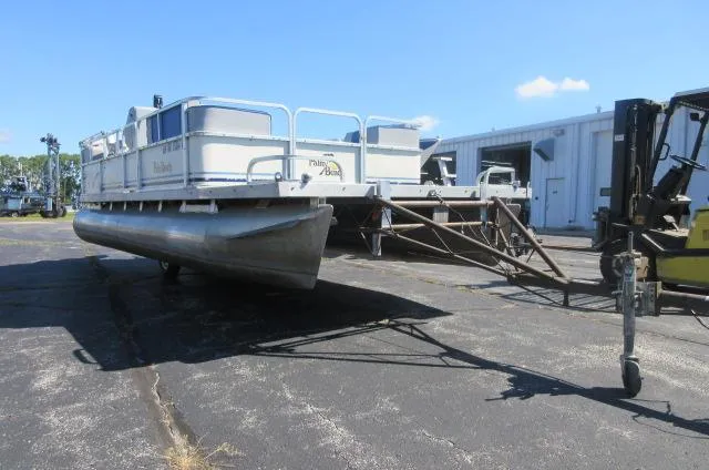 Slide: The Image of 1991 Palm Beach Super 220 pontoon boat on trailer in parking lot. - 15