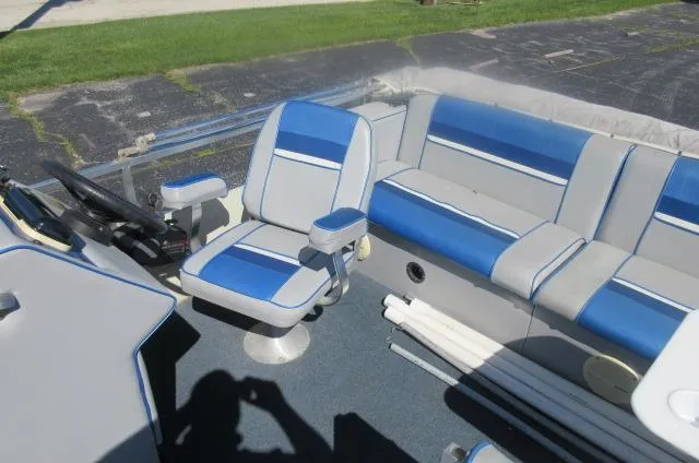 Slide: The Image of Interior of a 1991 Palm Beach Super 220 boat with blue and gray seating. - 20