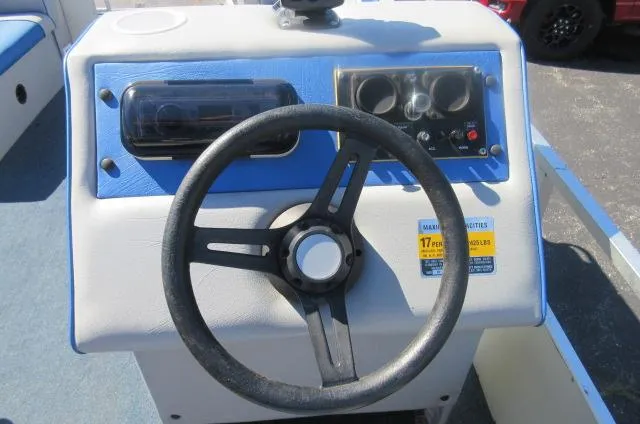 Slide: The Image of Steering console of a 1991 Palm Beach Super 220 boat with blue accents. - 22