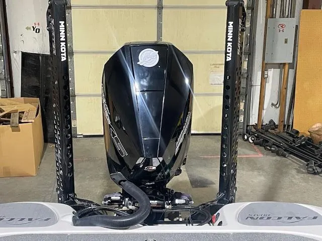 Slide: The Image of 2023 Falcon Boats F205 with Minn Kota motor in a garage setting. - 11