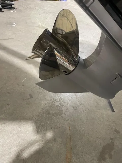 Slide: The Image of 2023 Falcon Boats F205 propeller on concrete floor, showcasing sleek design and metallic finish. - 4