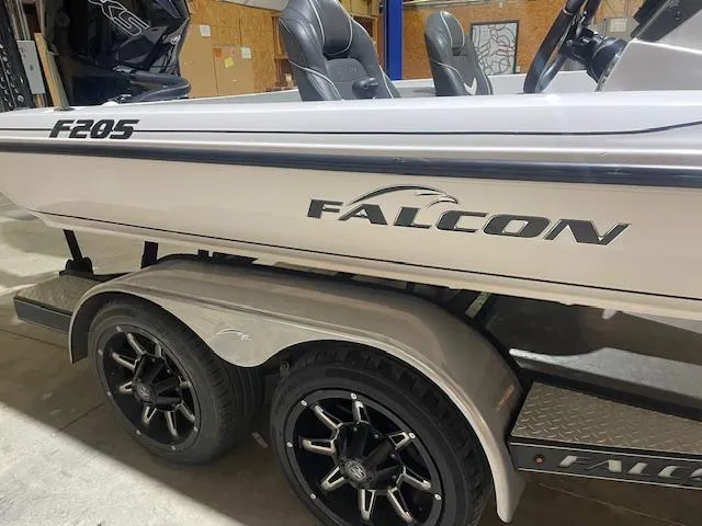 Slide: The Image of 2023 Falcon Boats F205 on trailer, featuring sleek design and modern wheels. - 6