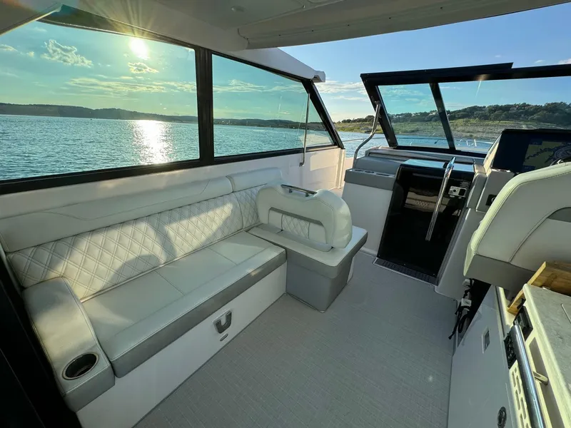 Slide: The Image of Interior of 2021 Regal 36 Grande Coupe yacht with luxurious seating and scenic water view. - 22