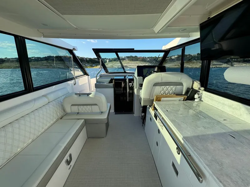 Slide: The Image of Interior of 2021 Regal 36 Grande Coupe yacht with luxurious seating and modern amenities. - 3