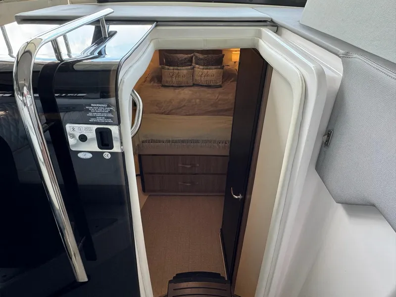 Slide: The Image of Interior view of 2021 Regal 36 Grande Coupe cabin with bed and storage. - 39