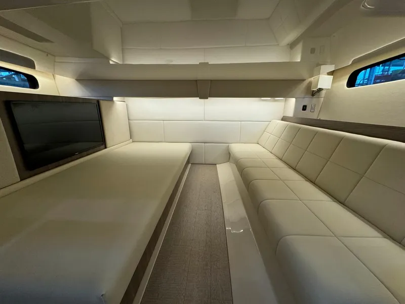 Slide: The Image of Interior of 2021 Regal 36 Grande Coupe with luxurious beige seating and modern design. - 41