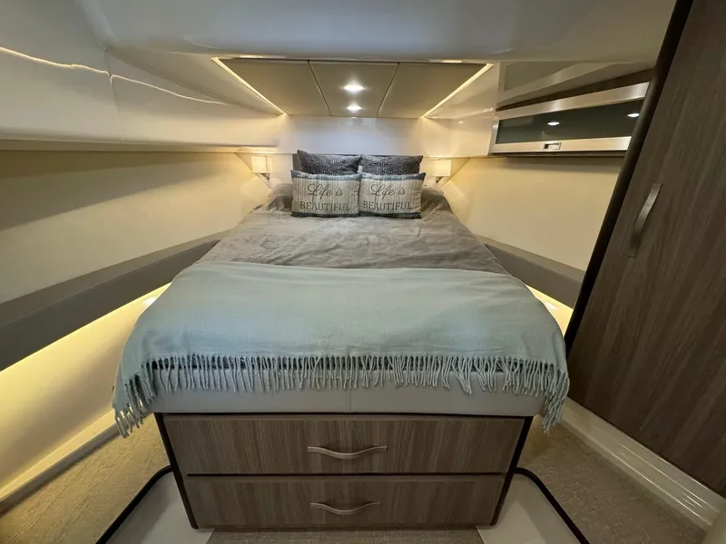 Slide: The Image of Luxurious bedroom interior of 2021 Regal 36 Grande Coupe yacht with cozy bedding. - 46