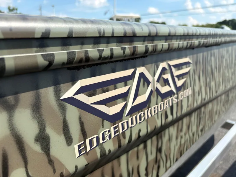 Slide: The Image of 2025 Edge Duck Boats Standard 656DB with camouflage design and logo. - 10