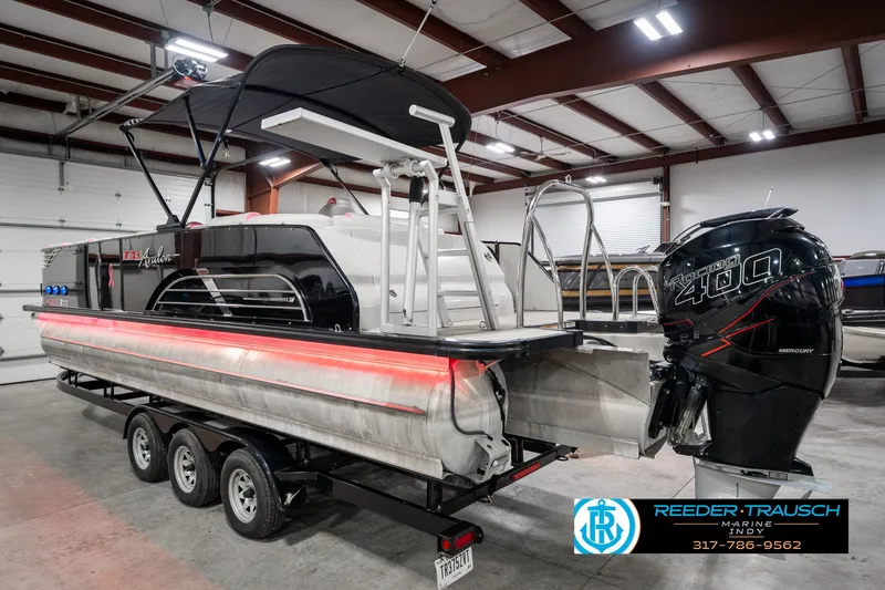 Slide: The Image of 2019 Avalon Ambassador 27' pontoon boat with Mercury Racing 400 engine in a showroom. - 10