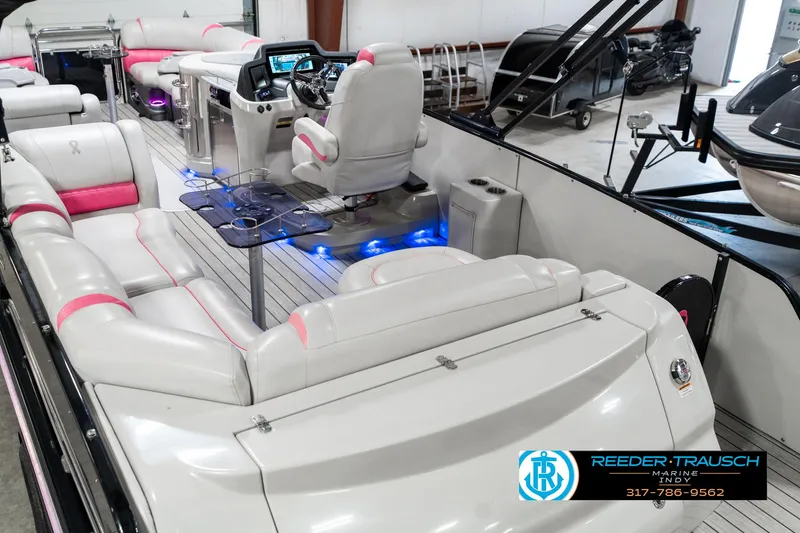 Slide: The Image of 2019 Avalon Ambassador 27' pontoon boat with luxurious seating and modern dashboard. - 15