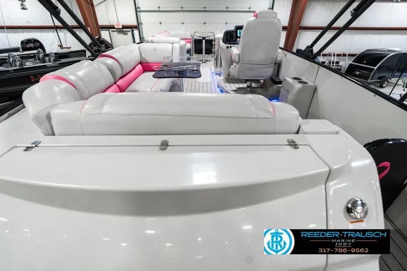 Slide: The Image of Interior of 2019 Avalon Ambassador 27' boat with plush seating and modern controls. - 19