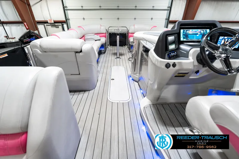Slide: The Image of Interior of 2019 Avalon Ambassador 27' boat with modern dashboard and plush seating. - 20