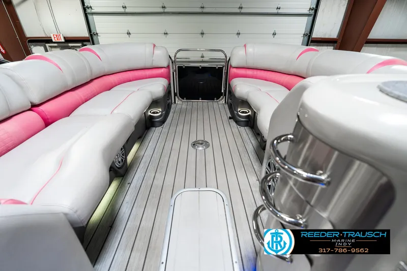 Slide: The Image of Luxurious 2019 Avalon Ambassador 27' pontoon boat interior with pink and gray seating. - 23