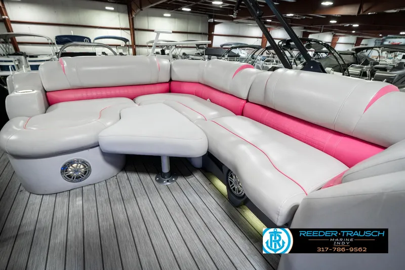 Slide: The Image of Luxurious seating on 2019 Avalon Ambassador 27' pontoon boat with pink accents. - 36