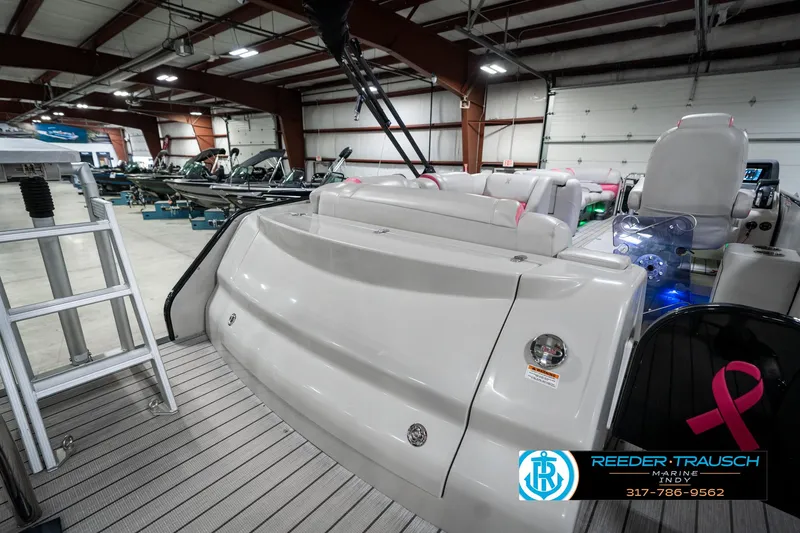 Slide: The Image of 2019 Avalon Ambassador 27' boat interior in showroom, featuring luxurious seating and modern design. - 37