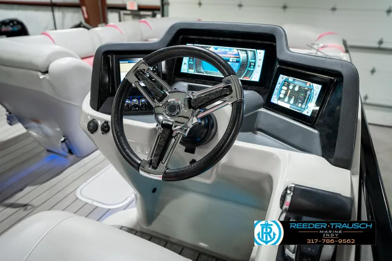 Slide: The Image of 2019 Avalon Ambassador boat dashboard with steering wheel and digital displays. - 39
